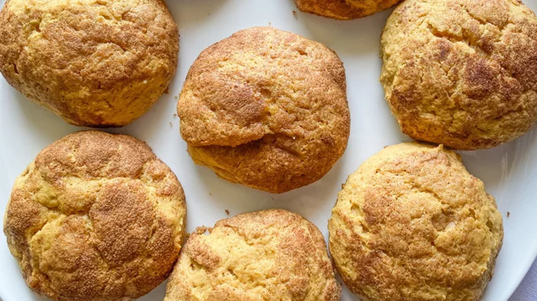 Browned cookies on a white plate