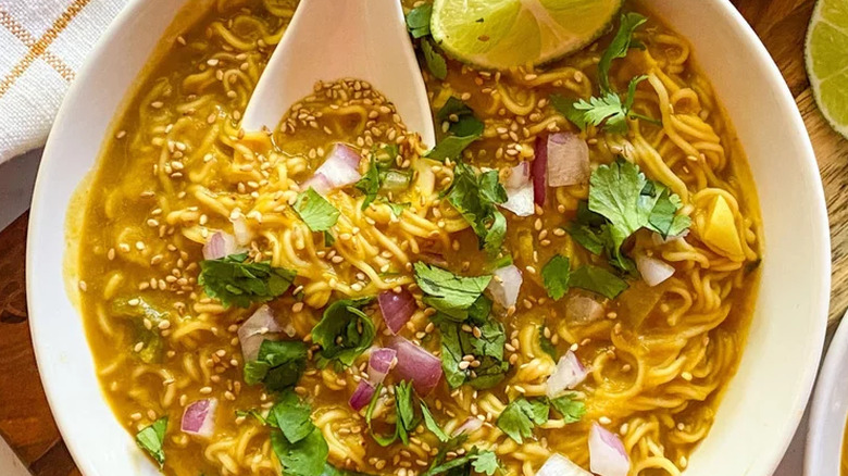 Bowl of ramen noodles and pumpkin broth.