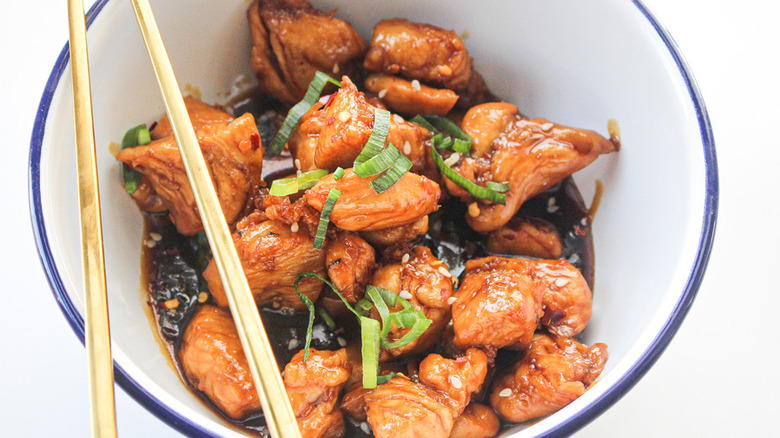 Cubed chicken in a dark teriyaki sauce