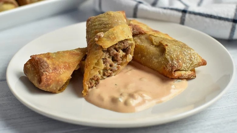 Cheeseburger egg rolls on plate