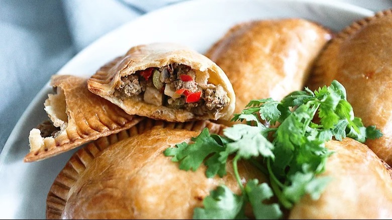 Empanadas with cilantro sprig