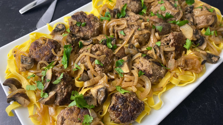 Salisbury steak on egg noodles