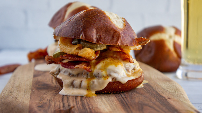 Bacon cheeseburger on pretzel bun