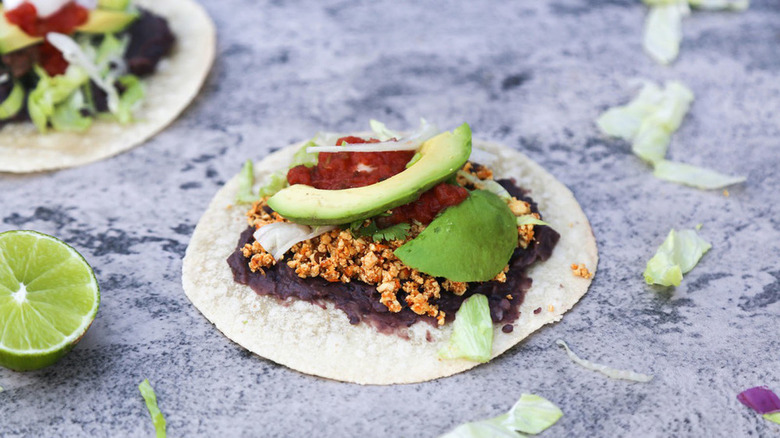 Tostada topped with guacamole