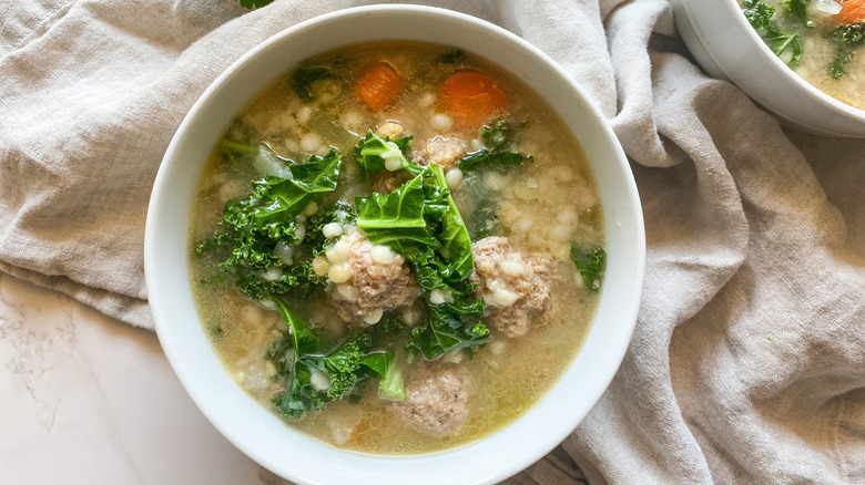 Italian wedding soup in white bowl