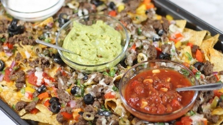 Pan of nachos with toppings