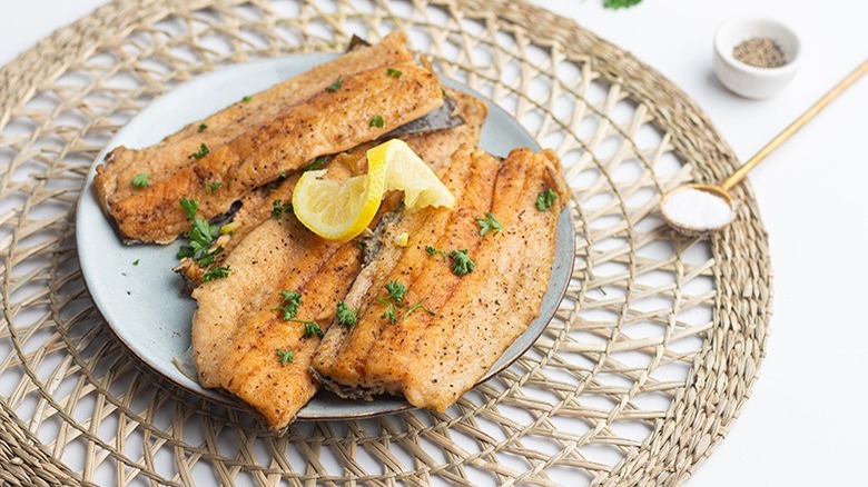 sauteed trout fillets on plate