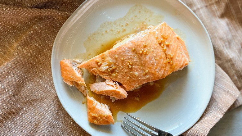 salmon fillet on white plate