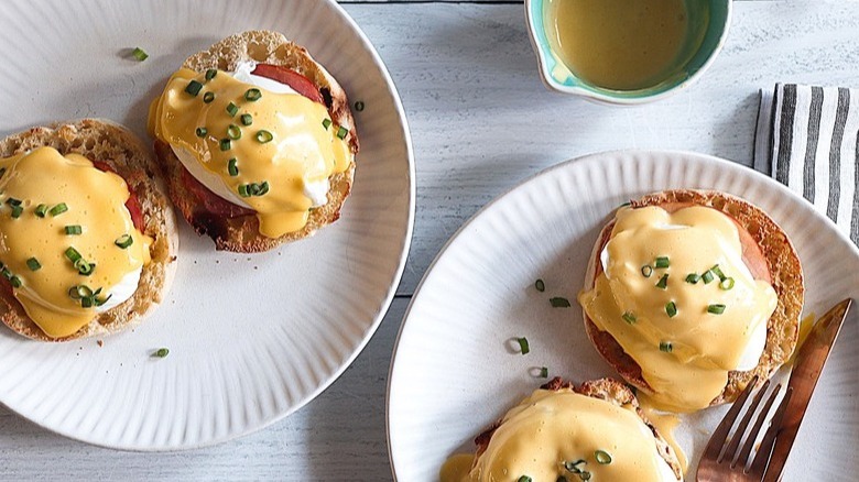 eggs Benedict on white plates