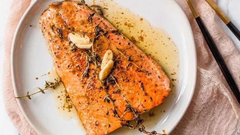 salmon fillet on white plate