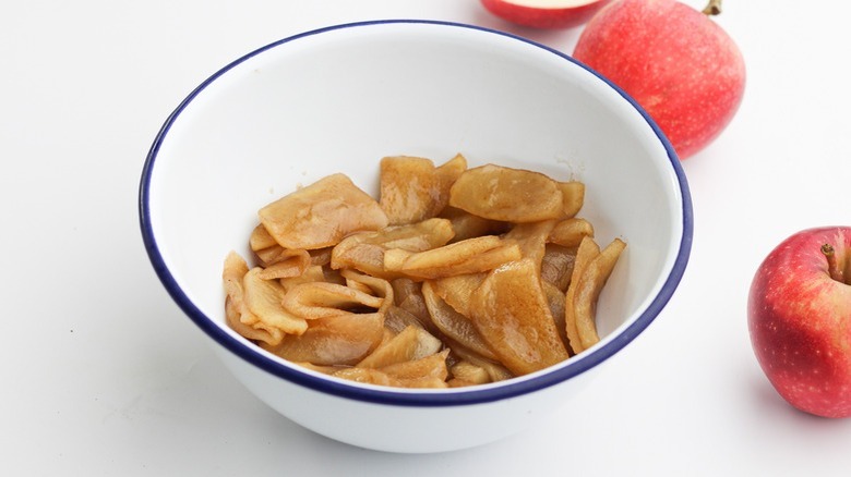 cooked apples in white bowl