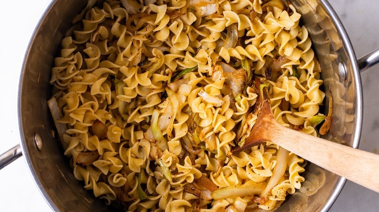 noodles and cabbage in pan