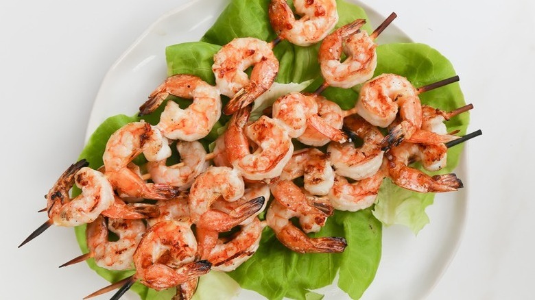 shrimp on skewers with lettuce