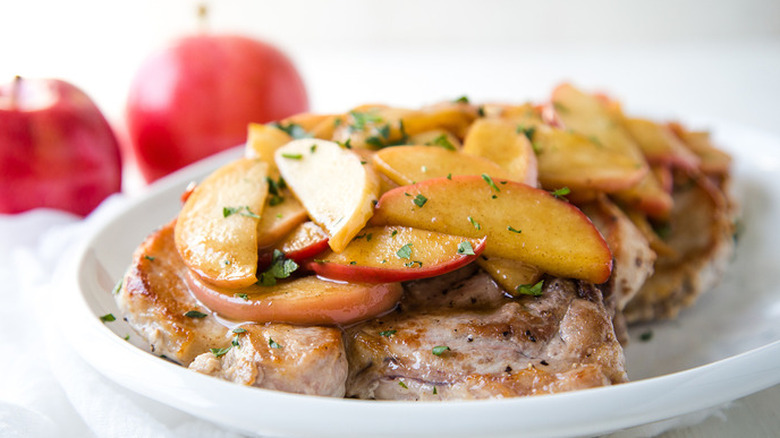 Pork chops topped with cooked apples