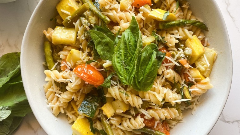 bowl of pasta primavera with garnish