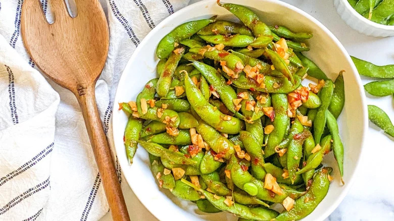 Spicy Garlic Edamame and wooden fork