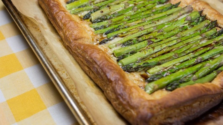 baking sheet with asparagus and gruyere tart