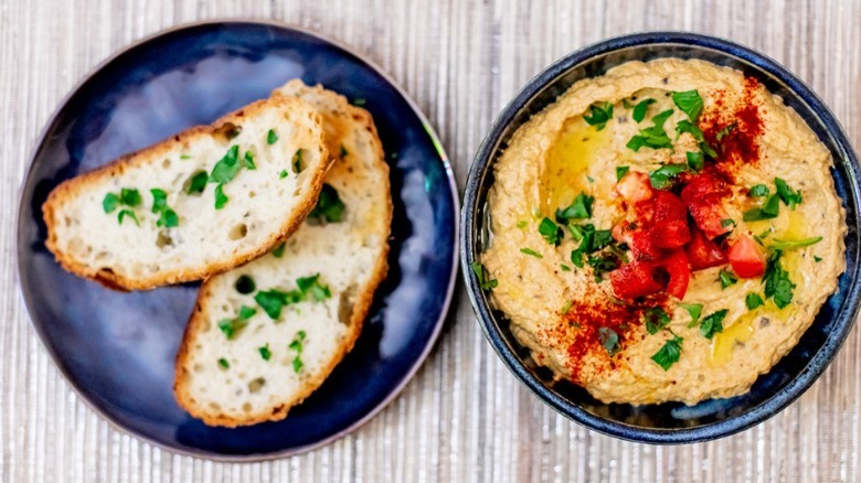 sliced bread and bowl of baba ganoush