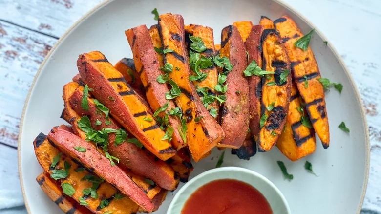 plate of grilled sweet potato wedges and ketchup