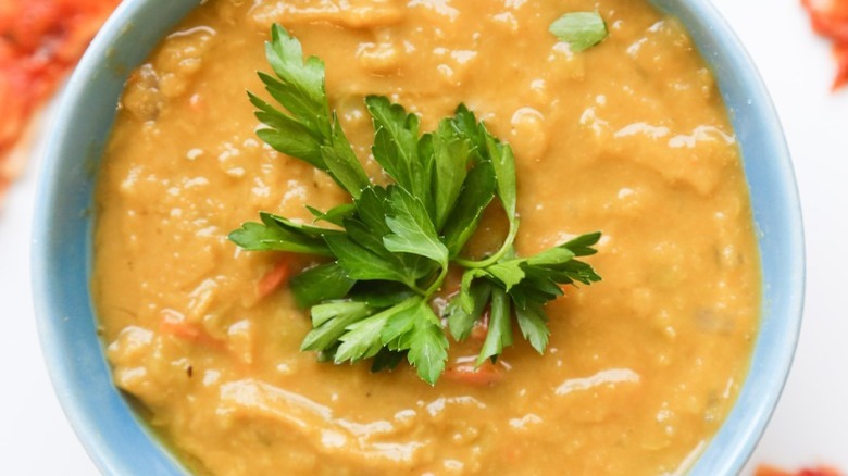 bowl of split pea soup with garnish