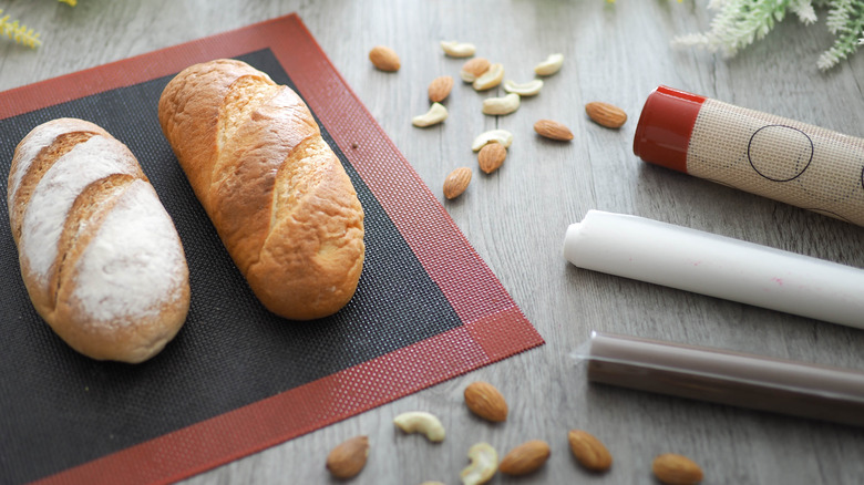 Loaves of bread on red and black silpat