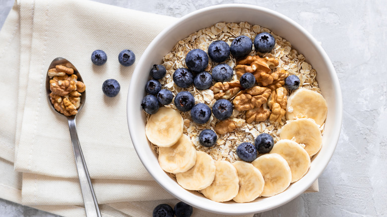 a healthy breakfast of oats, fruit and nuts