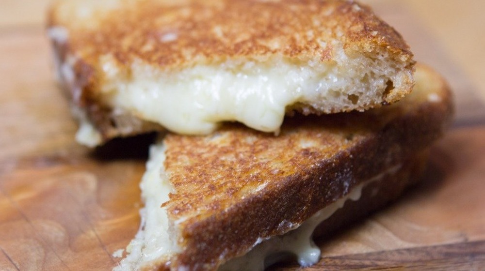 grilled cheese on wood surface