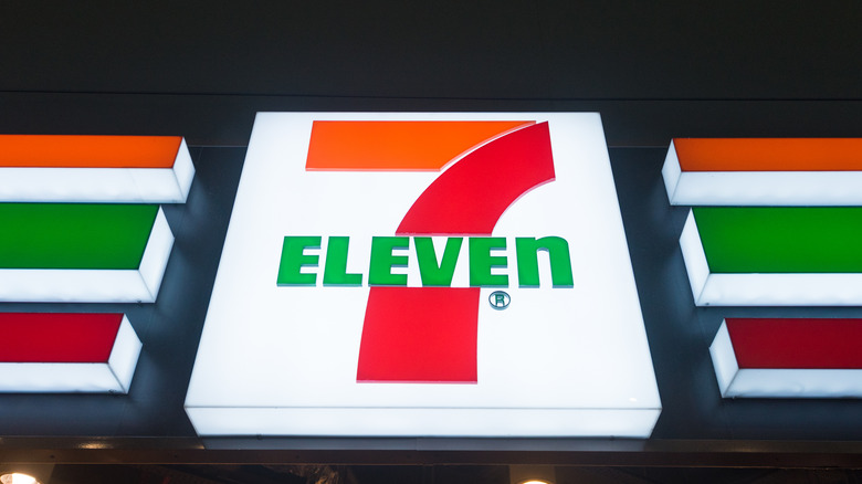 The 7 Eleven sign on the exterior of a building.