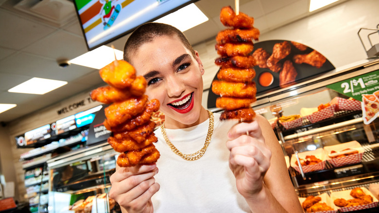 Person smiling with boneless wings at 7-Eleven