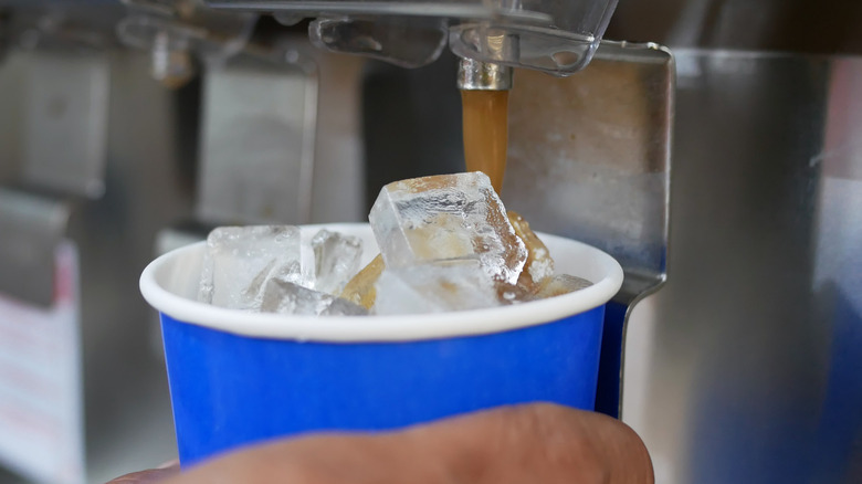 Cup getting iced coffee from dispenser