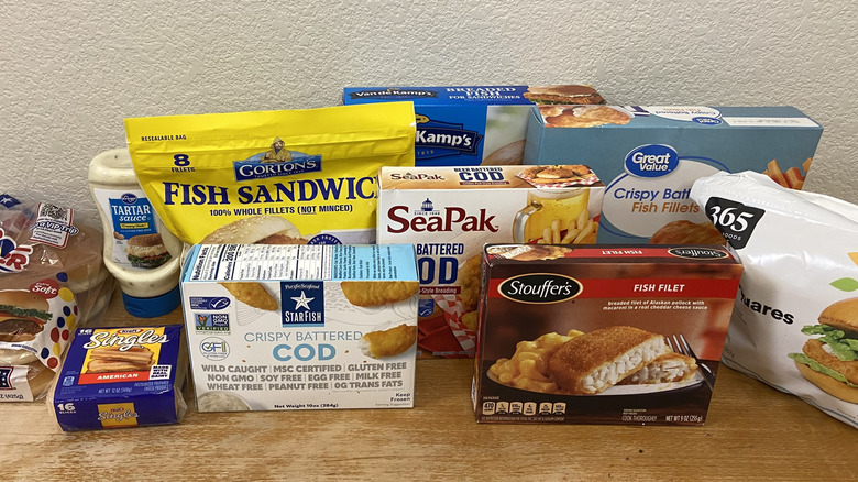 Assorted frozen fish fillet packages and sandwich ingredients