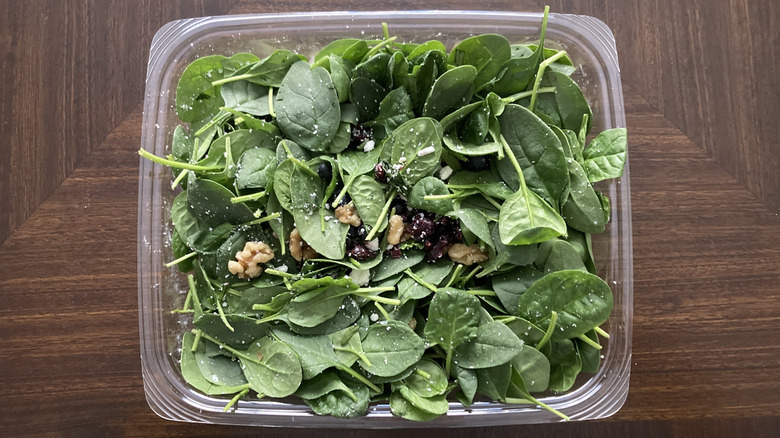 Container of spinach salad