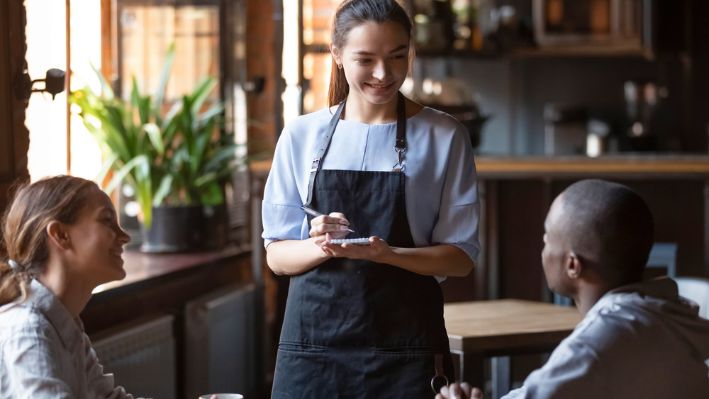 server taking food orders