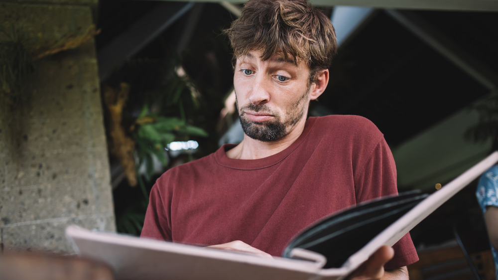 person reading food menu