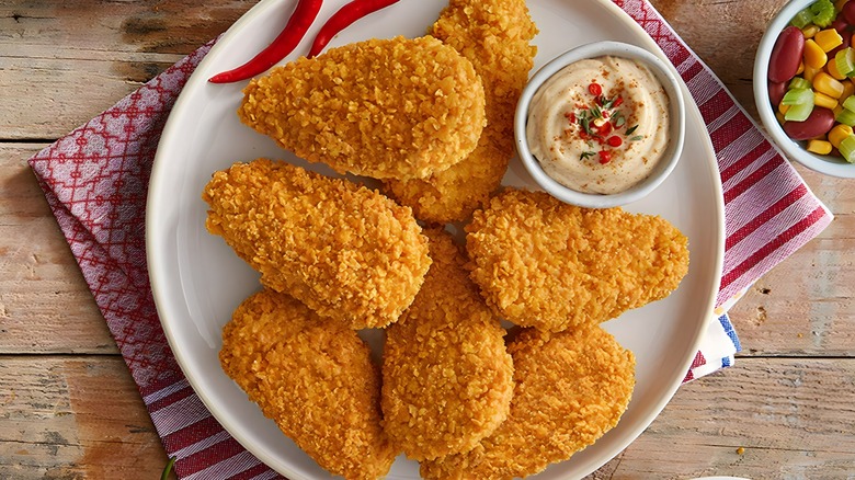 chicken nuggets with dip on plate