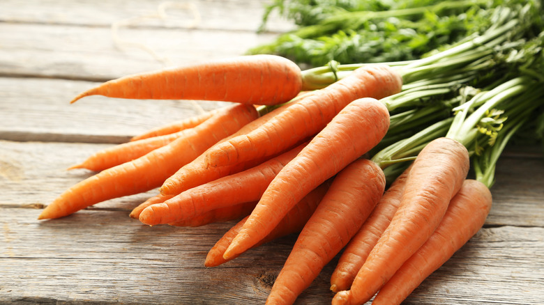 carrots on wood surface