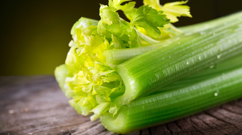 stalks of celery on wood