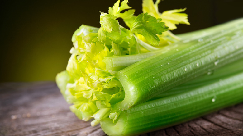 stalks of celery on wood