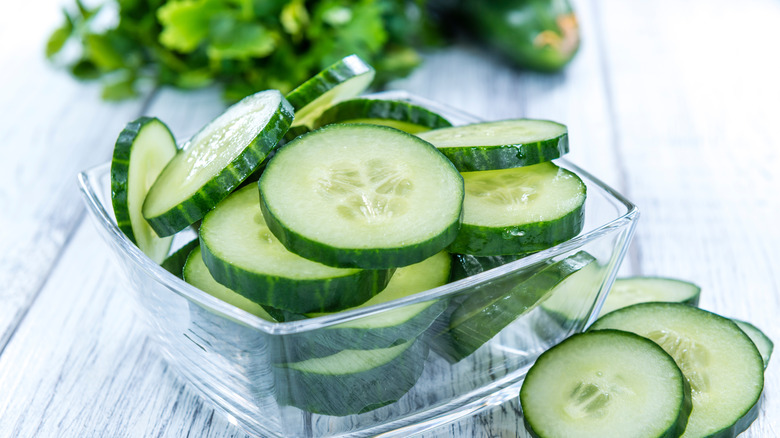 glass container of cucumbers