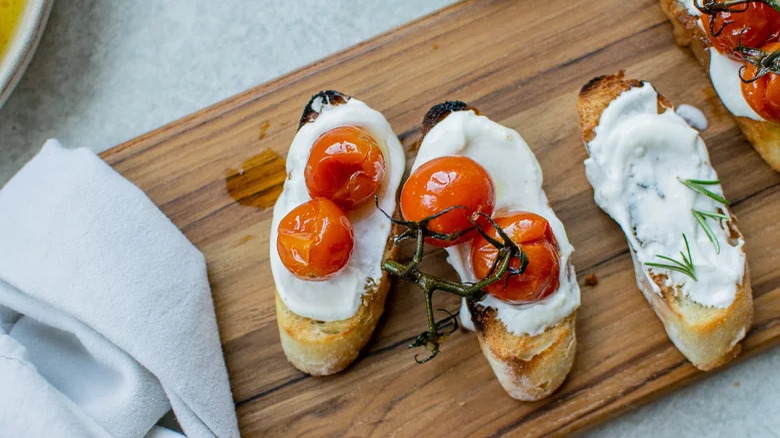 Goat Cheese Crostini with vine tomatoes and board