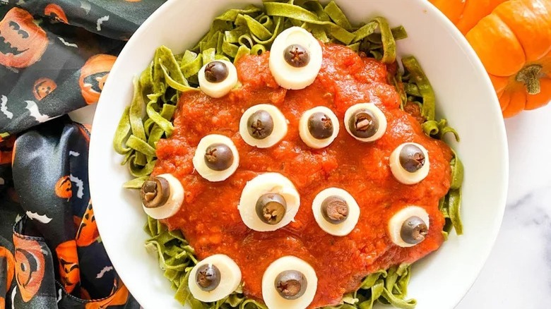 bowl of halloween pasta with eyeballs