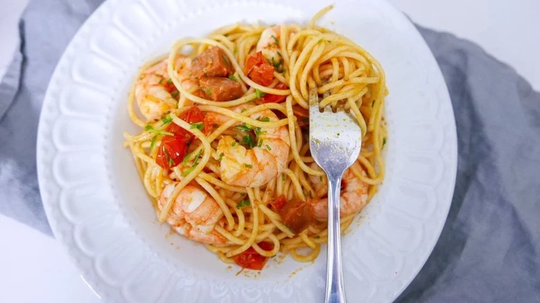 plate of chorizo and shrimp pasta with fork