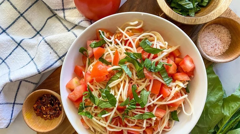 bowl of hearts of palm pasta with tomatoes and spices