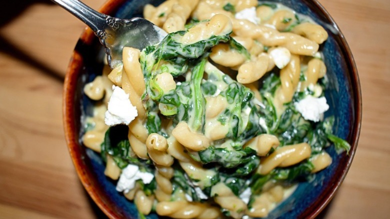 bowl of spinach and feta mac and cheese