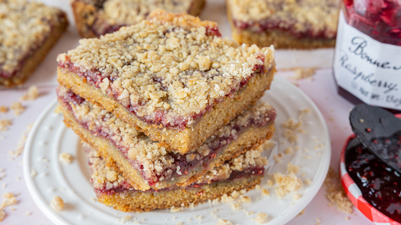 raspberry bars on white plate