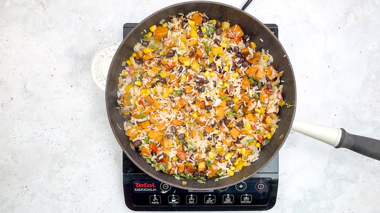 rice, bean, and corn mixture in pan