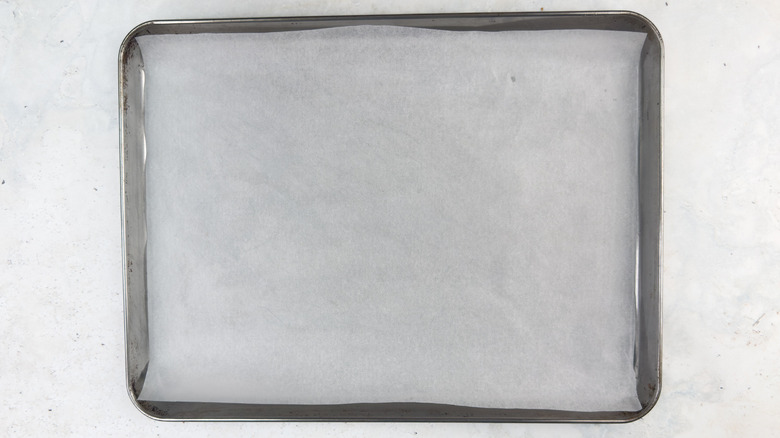 rimmed sheet lined with parchment paper