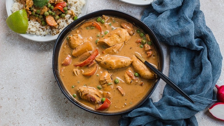 chicken curry in black bowl