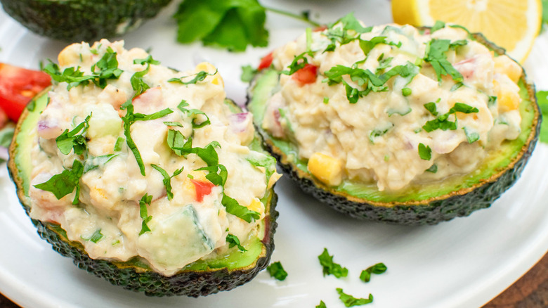 close up smashed chickpea stuffed avocados