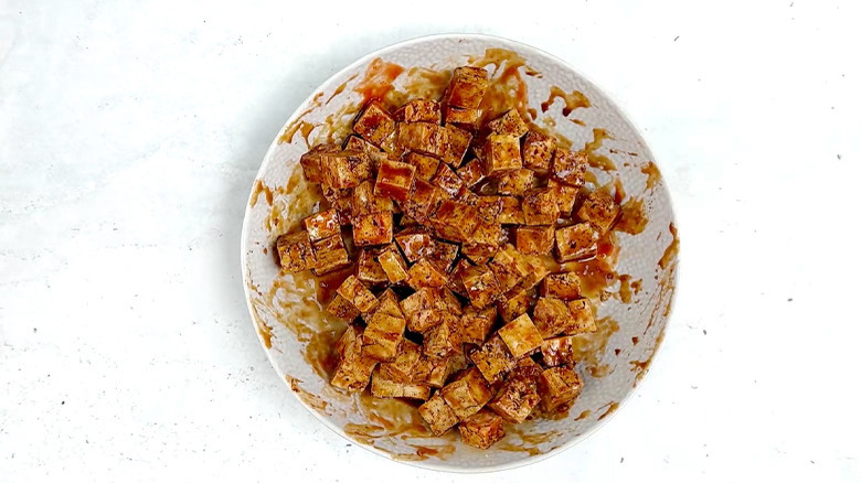 tofu marinating in sriracha, maple syrup, soy sauce